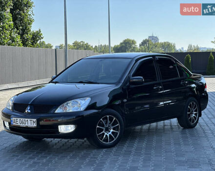 Чорний Міцубісі Lancer, об'ємом двигуна 1.58 л та пробігом 191 тис. км за 4899 $, фото 1 на Automoto.ua