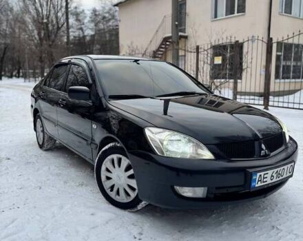 Черный Мицубиси Лансер, объемом двигателя 1.6 л и пробегом 234 тыс. км за 5000 $, фото 1 на Automoto.ua