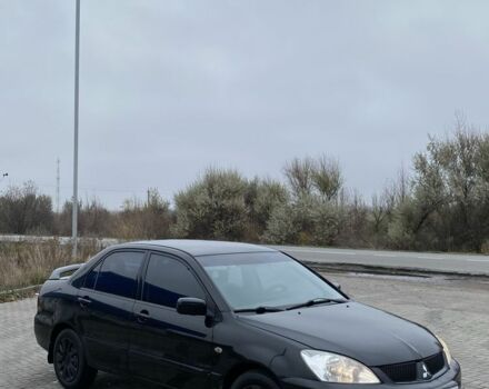 Черный Мицубиси Лансер, объемом двигателя 1.6 л и пробегом 263 тыс. км за 2900 $, фото 1 на Automoto.ua