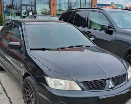 Черный Мицубиси Лансер, объемом двигателя 1.6 л и пробегом 212 тыс. км за 6900 $, фото 1 на Automoto.ua