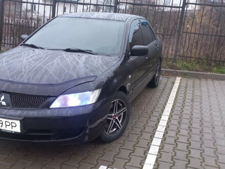 Черный Мицубиси Лансер, объемом двигателя 1.58 л и пробегом 240 тыс. км за 5600 $, фото 1 на Automoto.ua