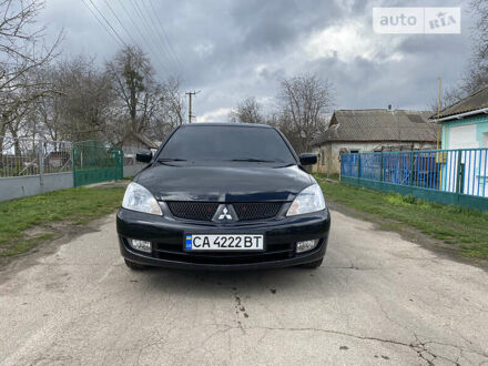 Чорний Міцубісі Lancer, об'ємом двигуна 1.6 л та пробігом 235 тис. км за 4900 $, фото 1 на Automoto.ua