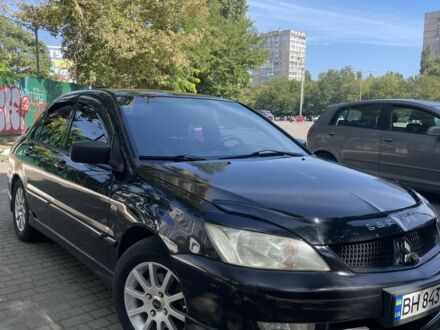 Черный Мицубиси Лансер, объемом двигателя 1.6 л и пробегом 3 тыс. км за 3900 $, фото 1 на Automoto.ua