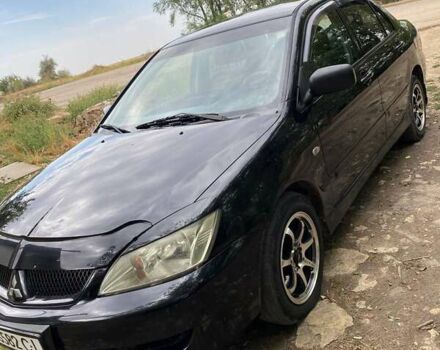 Чорний Міцубісі Lancer, об'ємом двигуна 1.58 л та пробігом 231 тис. км за 4300 $, фото 1 на Automoto.ua