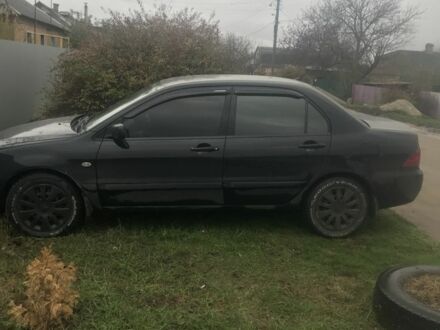 Чорний Міцубісі Lancer, об'ємом двигуна 1.6 л та пробігом 211 тис. км за 4400 $, фото 1 на Automoto.ua