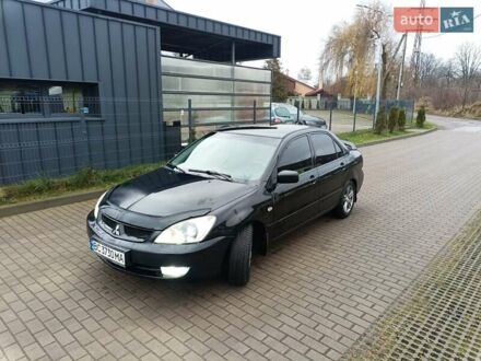 Черный Мицубиси Лансер, объемом двигателя 1.6 л и пробегом 144 тыс. км за 4200 $, фото 1 на Automoto.ua