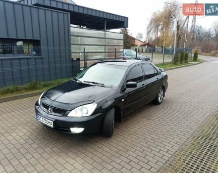 Черный Мицубиси Лансер, объемом двигателя 1.6 л и пробегом 144 тыс. км за 4200 $, фото 1 на Automoto.ua