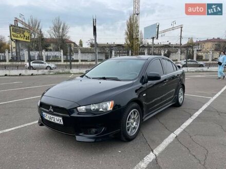 Черный Мицубиси Лансер, объемом двигателя 2 л и пробегом 246 тыс. км за 7500 $, фото 1 на Automoto.ua