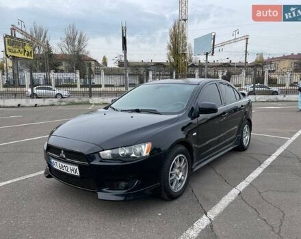 Чорний Міцубісі Lancer, об'ємом двигуна 2 л та пробігом 246 тис. км за 7500 $, фото 1 на Automoto.ua