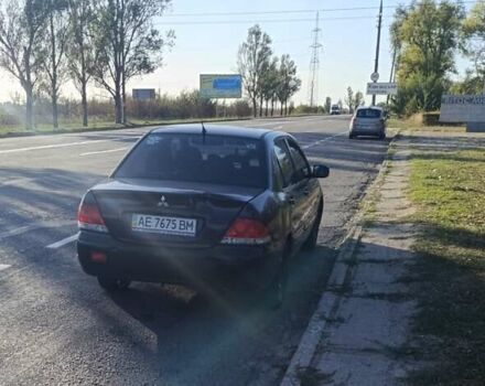 Чорний Міцубісі Lancer, об'ємом двигуна 1.58 л та пробігом 320 тис. км за 2500 $, фото 1 на Automoto.ua