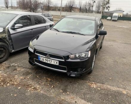 Черный Мицубиси Лансер, объемом двигателя 2 л и пробегом 247 тыс. км за 7900 $, фото 1 на Automoto.ua