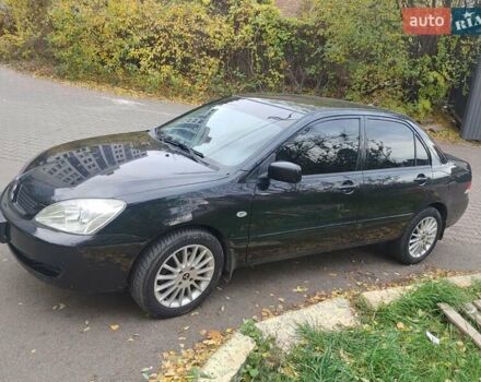 Чорний Міцубісі Lancer, об'ємом двигуна 1.58 л та пробігом 190 тис. км за 3750 $, фото 1 на Automoto.ua