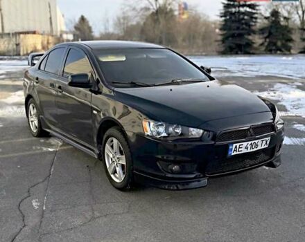 Черный Мицубиси Лансер, объемом двигателя 2 л и пробегом 230 тыс. км за 6800 $, фото 1 на Automoto.ua