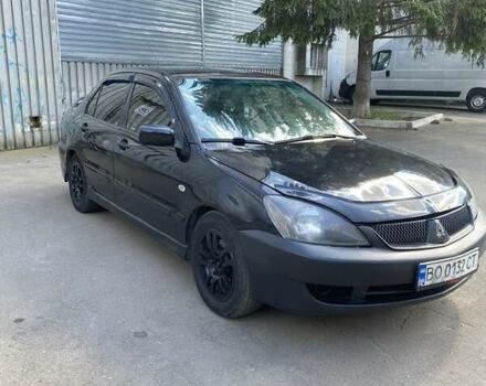 Чорний Міцубісі Lancer, об'ємом двигуна 2 л та пробігом 220 тис. км за 3300 $, фото 1 на Automoto.ua