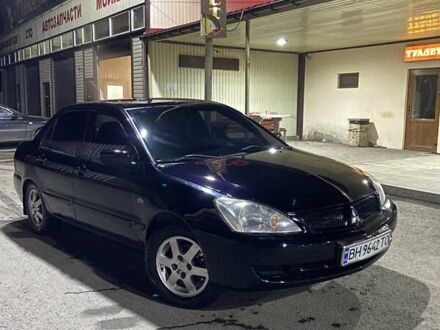 Чорний Міцубісі Lancer, об'ємом двигуна 1.58 л та пробігом 200 тис. км за 3300 $, фото 1 на Automoto.ua