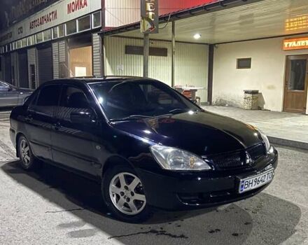 Черный Мицубиси Лансер, объемом двигателя 1.58 л и пробегом 200 тыс. км за 3300 $, фото 1 на Automoto.ua