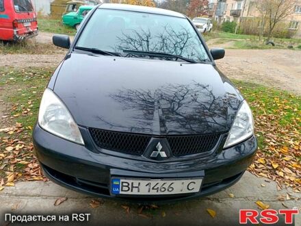 Черный Мицубиси Лансер, объемом двигателя 1.6 л и пробегом 227 тыс. км за 4100 $, фото 1 на Automoto.ua