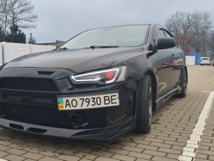 Черный Мицубиси Лансер, объемом двигателя 2 л и пробегом 160 тыс. км за 8000 $, фото 1 на Automoto.ua