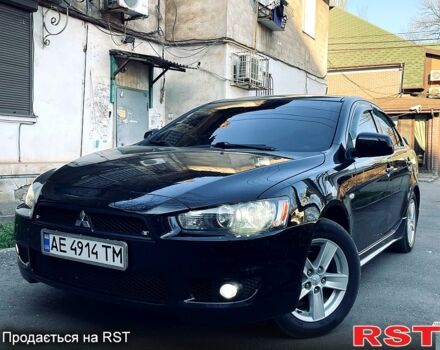 Черный Мицубиси Лансер, объемом двигателя 2 л и пробегом 202 тыс. км за 6800 $, фото 1 на Automoto.ua