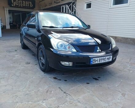 Чорний Міцубісі Lancer, об'ємом двигуна 1.59 л та пробігом 330 тис. км за 4250 $, фото 1 на Automoto.ua