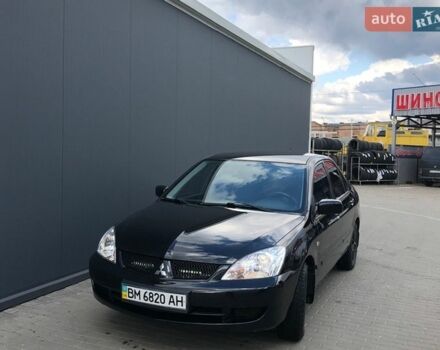 Черный Мицубиси Лансер, объемом двигателя 1.6 л и пробегом 237 тыс. км за 3400 $, фото 1 на Automoto.ua