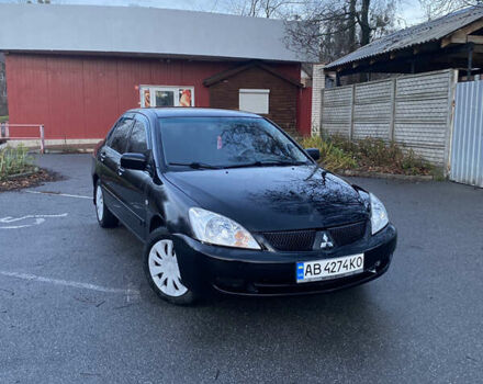 Черный Мицубиси Лансер, объемом двигателя 1.58 л и пробегом 280 тыс. км за 3650 $, фото 1 на Automoto.ua