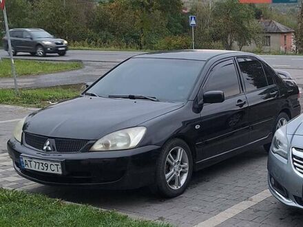 Чорний Міцубісі Lancer, об'ємом двигуна 2 л та пробігом 300 тис. км за 3200 $, фото 1 на Automoto.ua