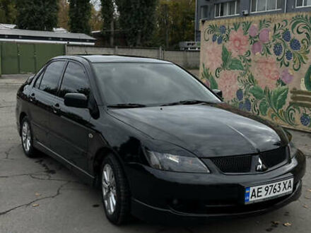 Черный Мицубиси Лансер, объемом двигателя 2 л и пробегом 143 тыс. км за 4999 $, фото 1 на Automoto.ua