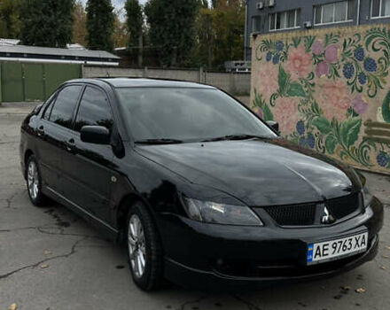 Черный Мицубиси Лансер, объемом двигателя 2 л и пробегом 143 тыс. км за 4999 $, фото 1 на Automoto.ua