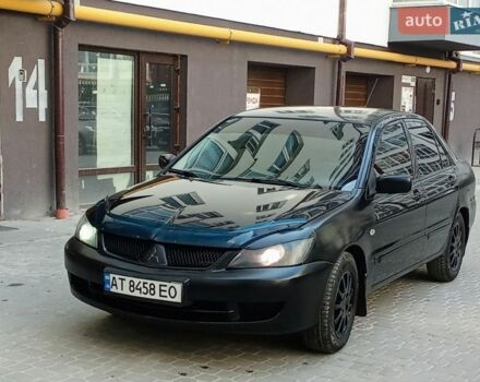 Черный Мицубиси Лансер, объемом двигателя 1.58 л и пробегом 269 тыс. км за 3150 $, фото 1 на Automoto.ua
