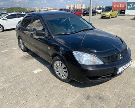 Черный Мицубиси Лансер, объемом двигателя 1.58 л и пробегом 235 тыс. км за 2700 $, фото 1 на Automoto.ua