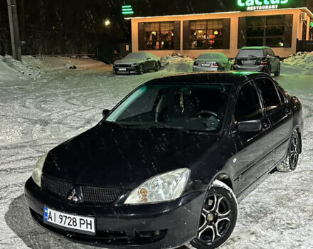 Чорний Міцубісі Lancer, об'ємом двигуна 1.58 л та пробігом 268 тис. км за 3950 $, фото 1 на Automoto.ua