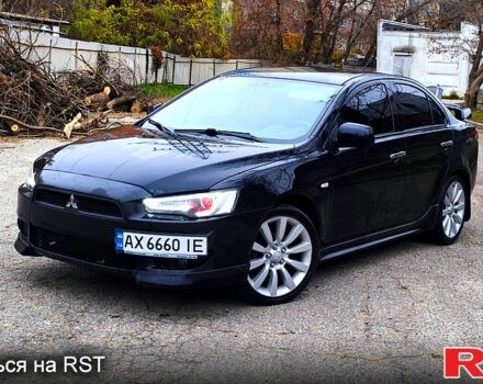 Черный Мицубиси Лансер, объемом двигателя 2 л и пробегом 230 тыс. км за 7100 $, фото 1 на Automoto.ua
