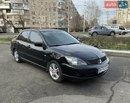 Черный Мицубиси Лансер, объемом двигателя 2 л и пробегом 271 тыс. км за 5300 $, фото 1 на Automoto.ua