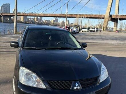 Черный Мицубиси Лансер, объемом двигателя 1.59 л и пробегом 222 тыс. км за 3900 $, фото 1 на Automoto.ua