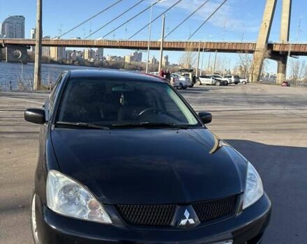 Черный Мицубиси Лансер, объемом двигателя 1.59 л и пробегом 222 тыс. км за 3900 $, фото 1 на Automoto.ua
