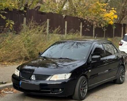 Черный Мицубиси Лансер, объемом двигателя 1.6 л и пробегом 212 тыс. км за 6950 $, фото 1 на Automoto.ua