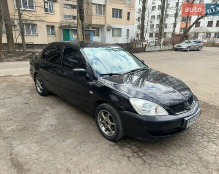 Черный Мицубиси Лансер, объемом двигателя 1.58 л и пробегом 150 тыс. км за 4500 $, фото 1 на Automoto.ua