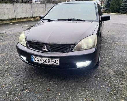 Чорний Міцубісі Lancer, об'ємом двигуна 1.6 л та пробігом 309 тис. км за 4000 $, фото 1 на Automoto.ua