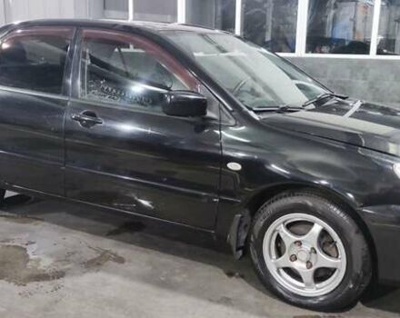 Черный Мицубиси Лансер, объемом двигателя 1.6 л и пробегом 88 тыс. км за 4650 $, фото 1 на Automoto.ua