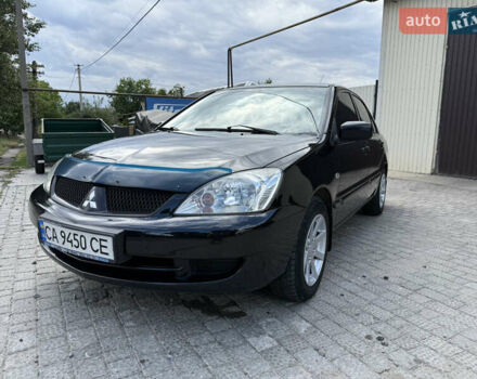 Чорний Міцубісі Lancer, об'ємом двигуна 1.58 л та пробігом 322 тис. км за 4000 $, фото 1 на Automoto.ua