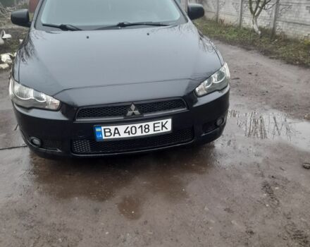 Черный Мицубиси Лансер, объемом двигателя 2 л и пробегом 215 тыс. км за 5700 $, фото 1 на Automoto.ua