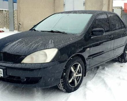 Чорний Міцубісі Lancer, об'ємом двигуна 1.58 л та пробігом 237 тис. км за 4300 $, фото 1 на Automoto.ua