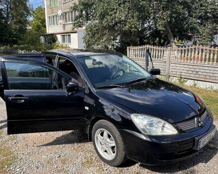 Чорний Міцубісі Lancer, об'ємом двигуна 1.6 л та пробігом 251 тис. км за 4700 $, фото 1 на Automoto.ua