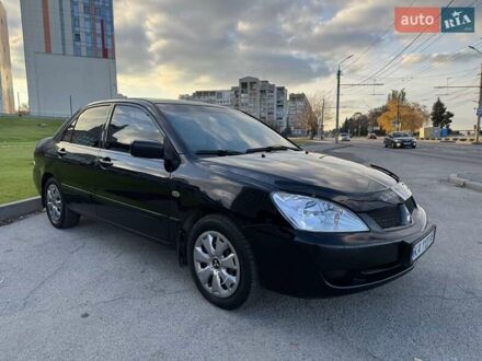 Чорний Міцубісі Lancer, об'ємом двигуна 1.58 л та пробігом 237 тис. км за 3950 $, фото 1 на Automoto.ua
