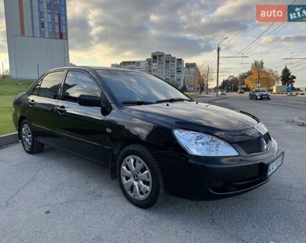 Черный Мицубиси Лансер, объемом двигателя 1.58 л и пробегом 237 тыс. км за 3950 $, фото 1 на Automoto.ua