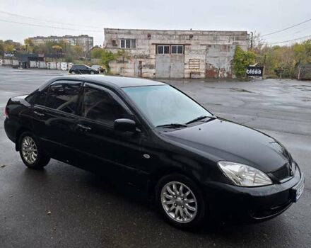 Черный Мицубиси Лансер, объемом двигателя 1.6 л и пробегом 200 тыс. км за 4150 $, фото 1 на Automoto.ua