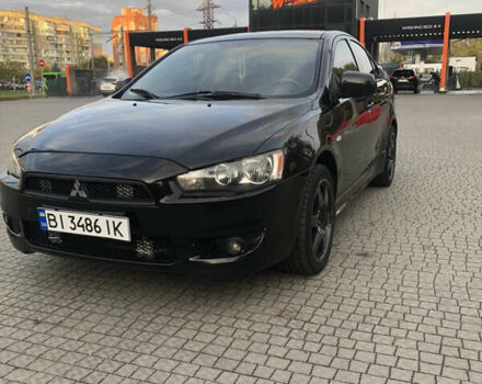 Чорний Міцубісі Lancer, об'ємом двигуна 2 л та пробігом 194 тис. км за 5999 $, фото 1 на Automoto.ua