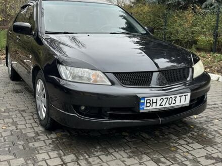 Черный Мицубиси Лансер, объемом двигателя 1.6 л и пробегом 300 тыс. км за 3400 $, фото 1 на Automoto.ua