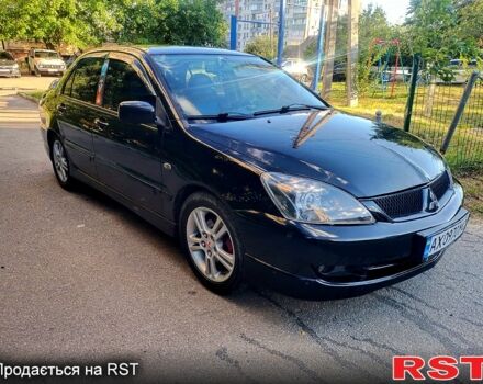 Чорний Міцубісі Lancer, об'ємом двигуна 2 л та пробігом 200 тис. км за 4450 $, фото 1 на Automoto.ua